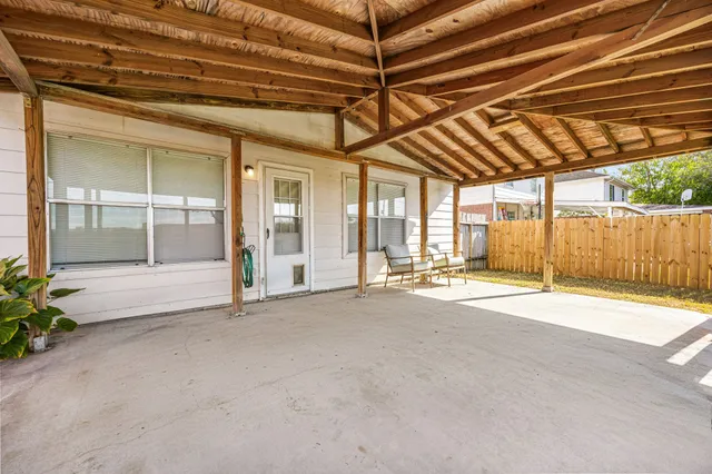 a view of a backyard with sitting area