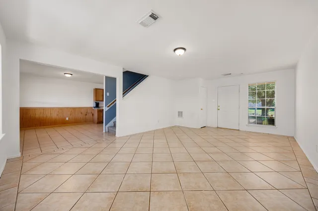 a view of an empty room and window