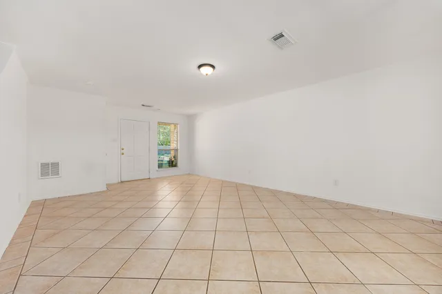 a view of an empty room and window