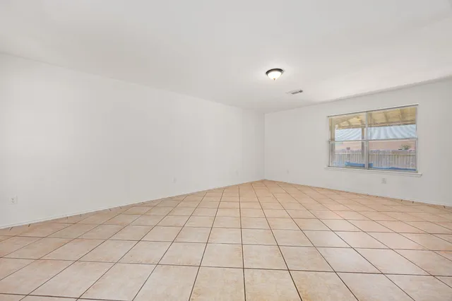 a view of an empty room and window