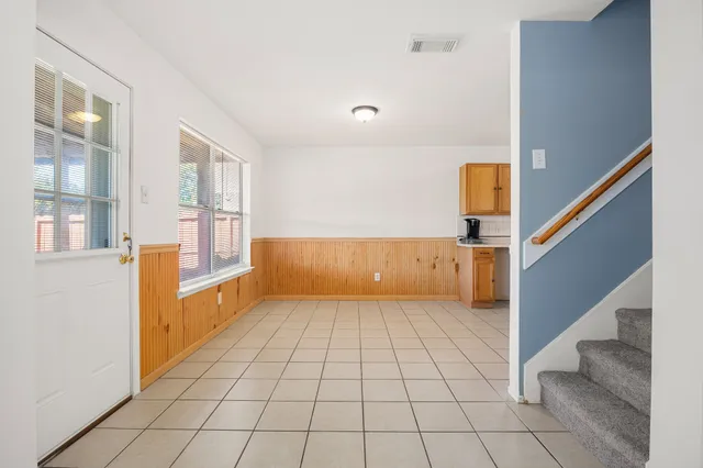 a view of a room with stairs and a couch
