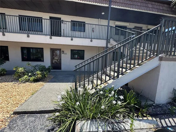 a view of entryway with flower pots