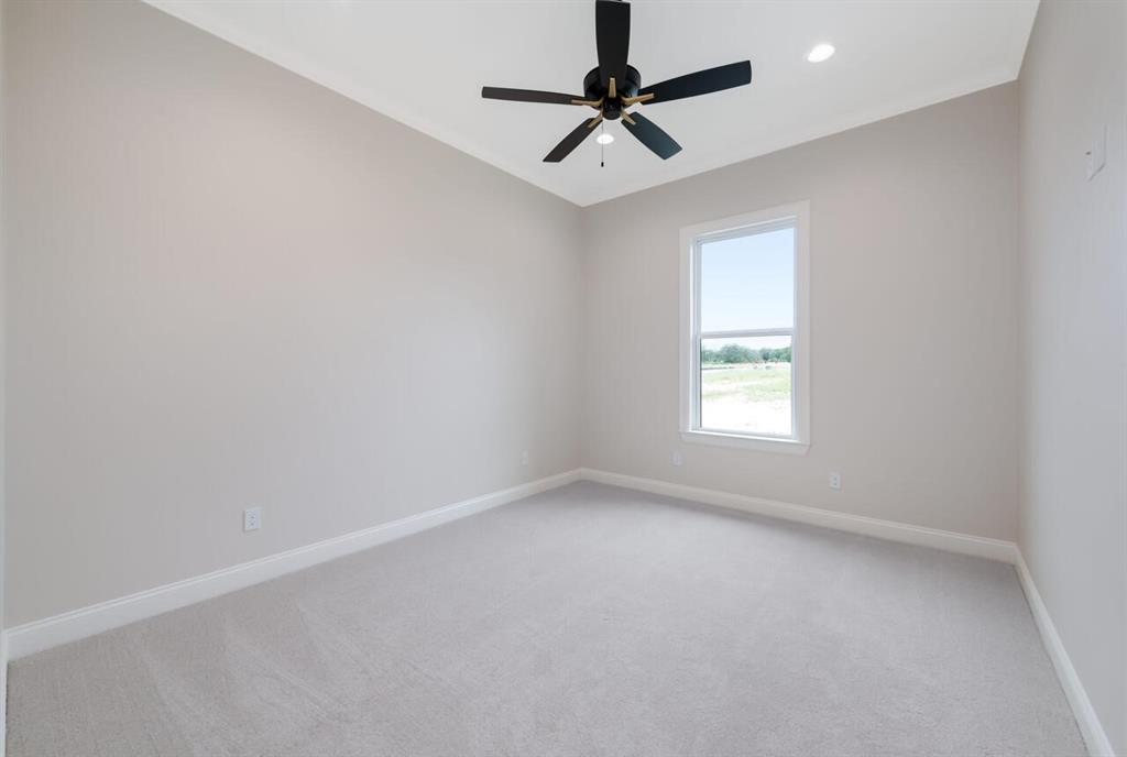 8005 Bee Cave Road China Spring, TX 76633 - Photo 32 of 40 an empty room with a window and a fan