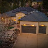a front view of a house with swimming pool having outdoor seating