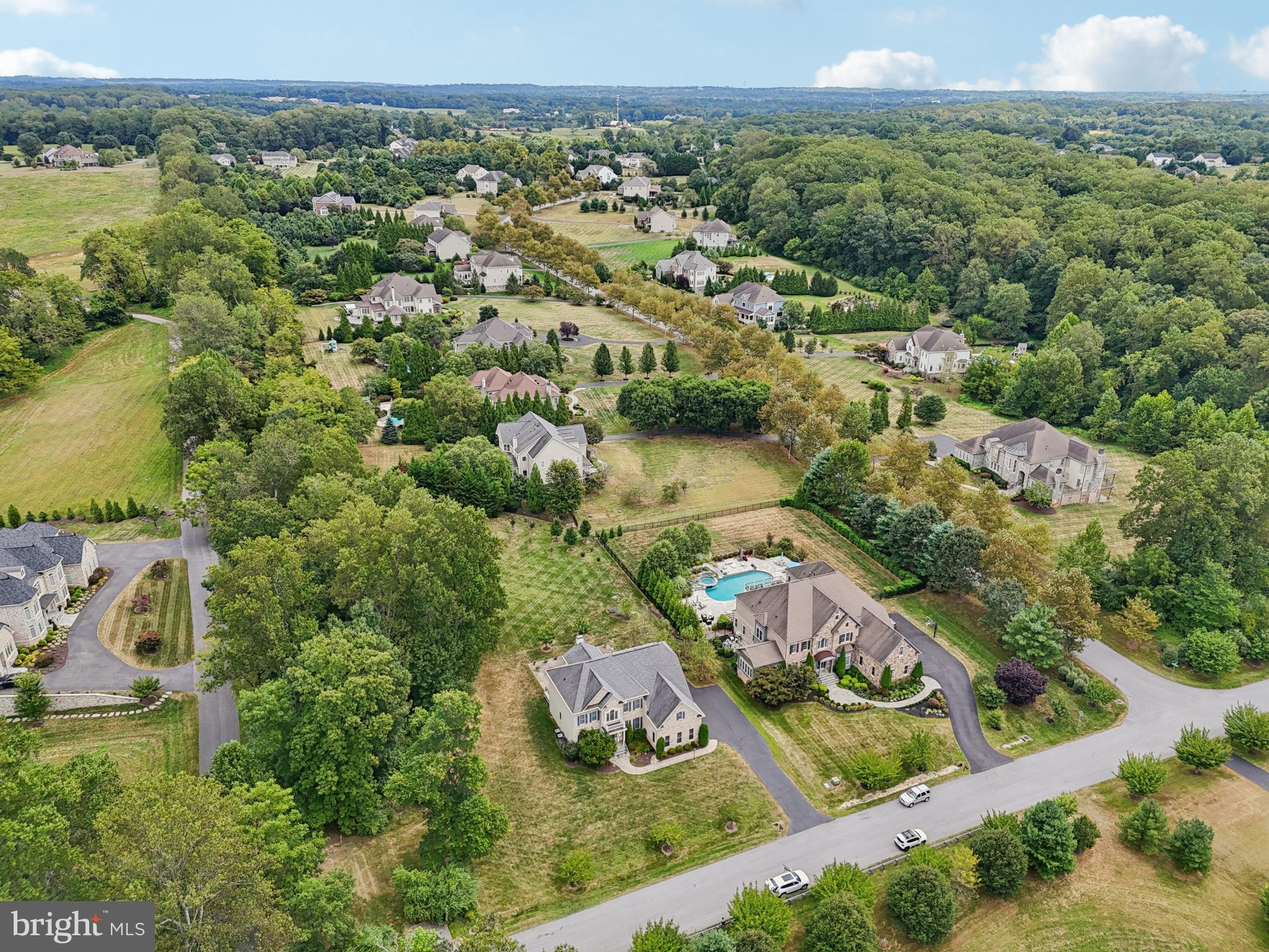4884 Castlebridge Road Ellicott City, MD 21042 - Photo 108 of 130 an aerial view of residential houses with outdoor space and trees