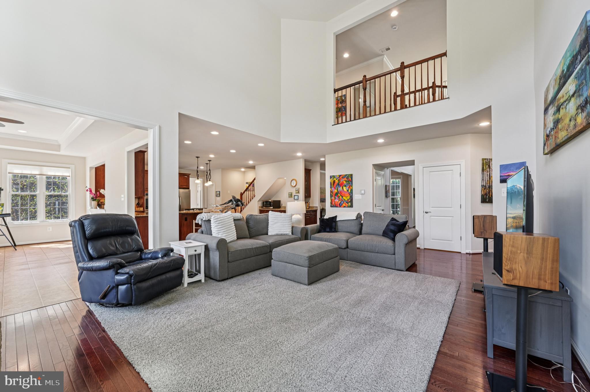 4884 Castlebridge Road Ellicott City, MD 21042 - Photo 18 of 130 a living room with furniture and a chandelier