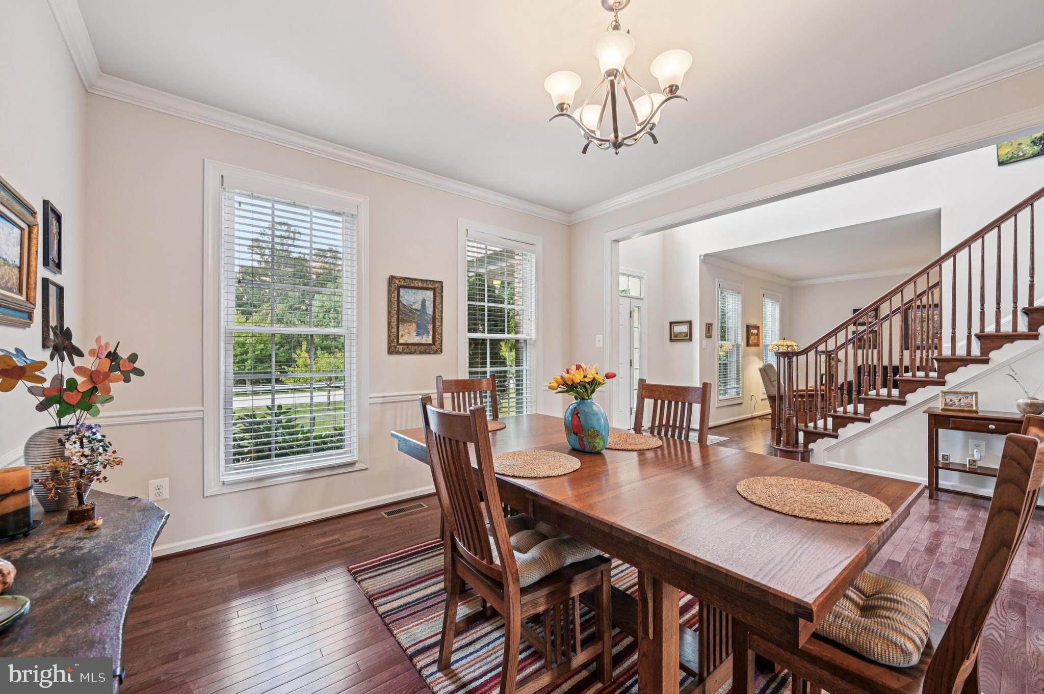 4884 Castlebridge Road Ellicott City, MD 21042 - Photo 24 of 130 a view of a dining room with furniture window and wooden floor
