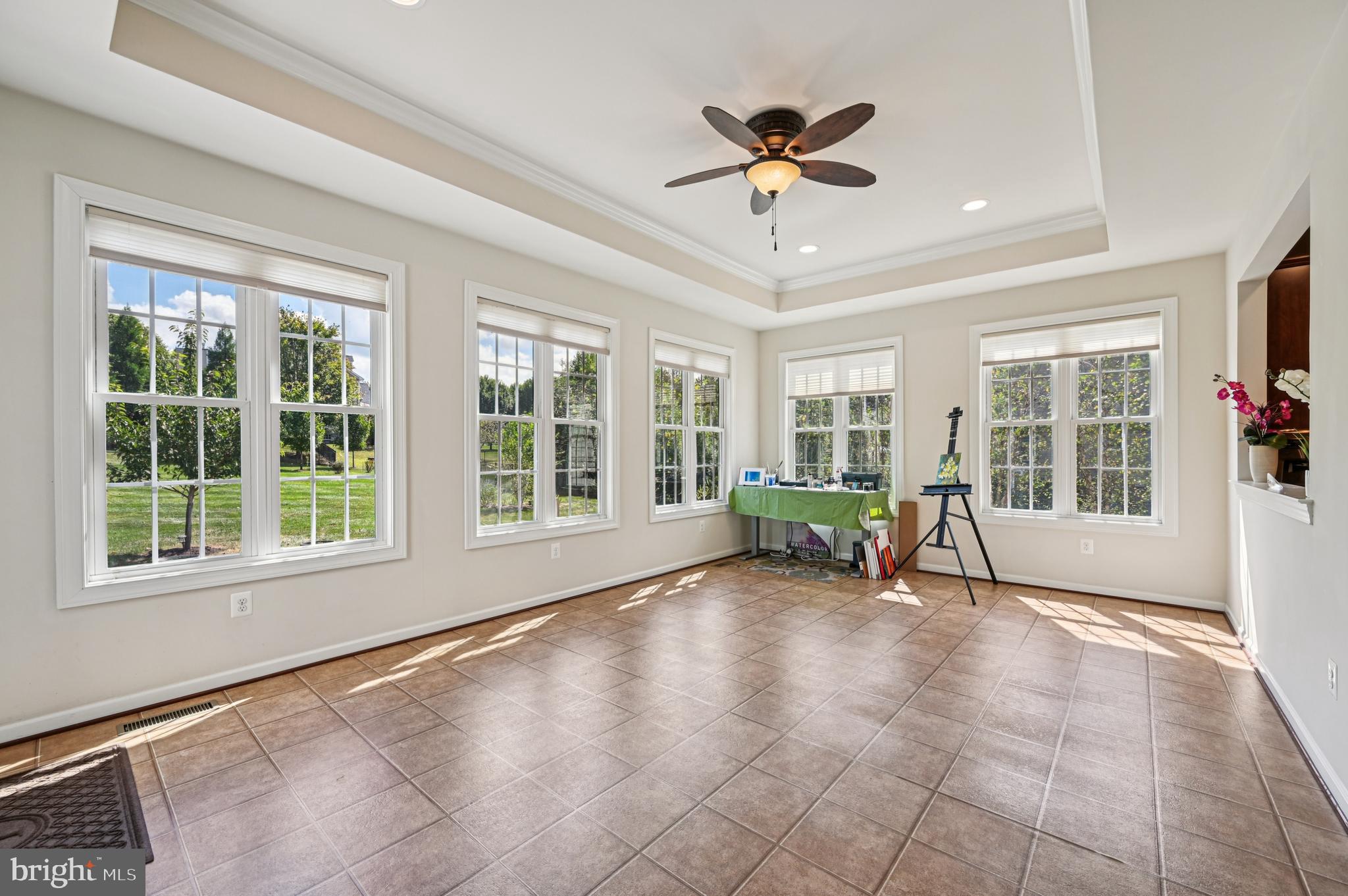 4884 Castlebridge Road Ellicott City, MD 21042 - Photo 37 of 130 a view of a livingroom with a ceiling fan and a large window