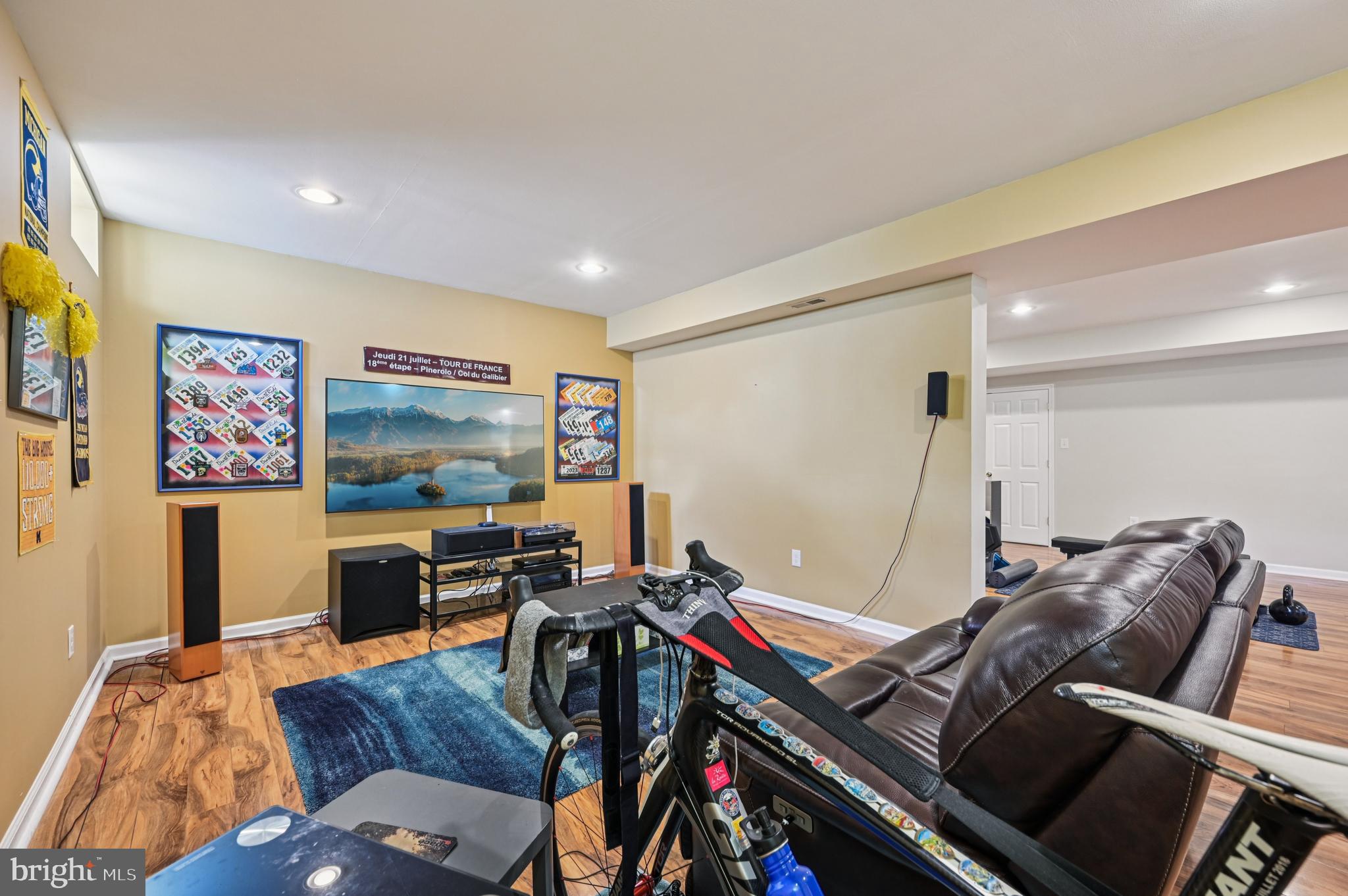 4884 Castlebridge Road Ellicott City, MD 21042 - Photo 52 of 130 a living room with furniture and a flat screen tv