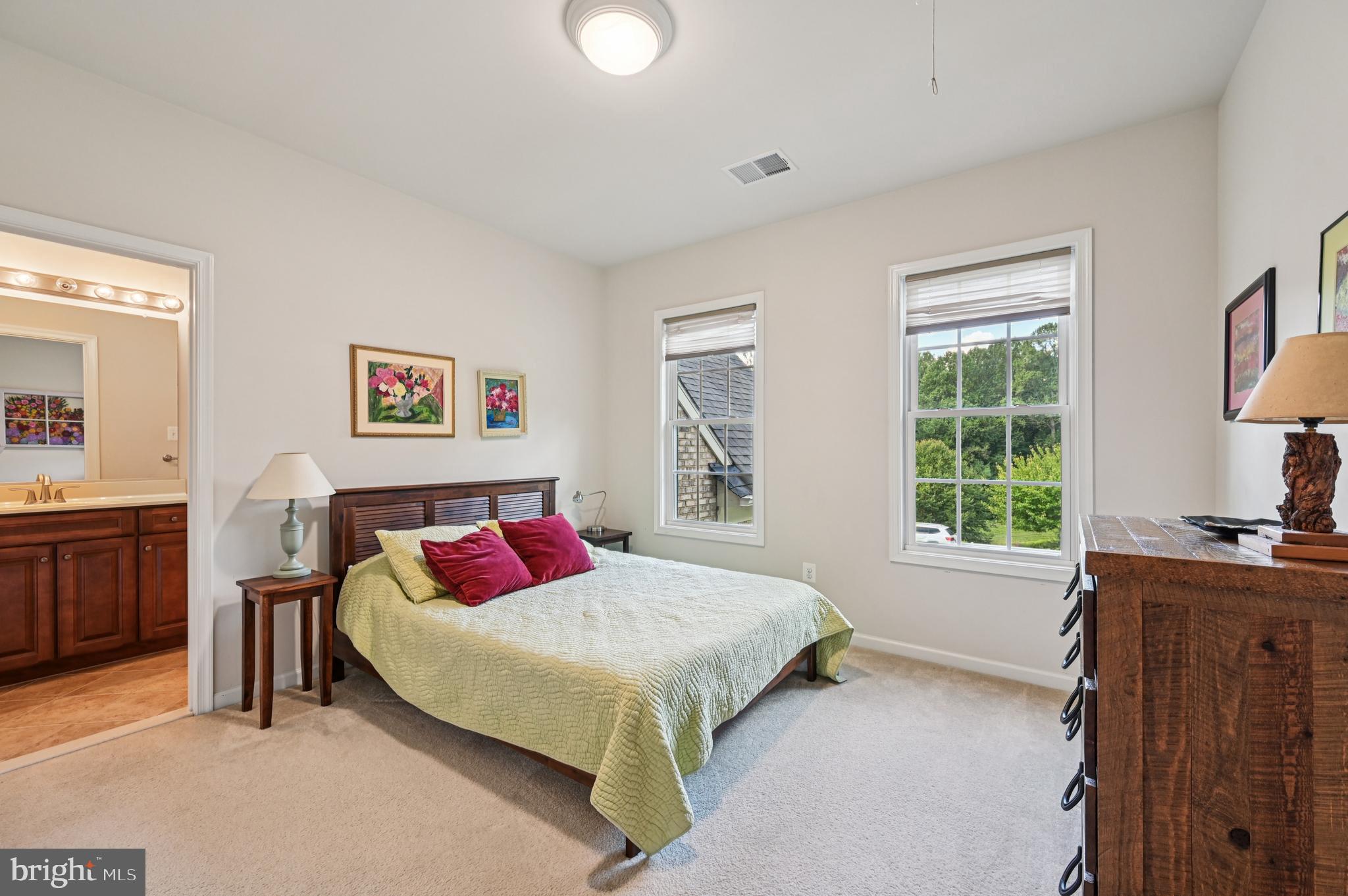4884 Castlebridge Road Ellicott City, MD 21042 - Photo 57 of 130 a bedroom with a bed and a dresser next to a window