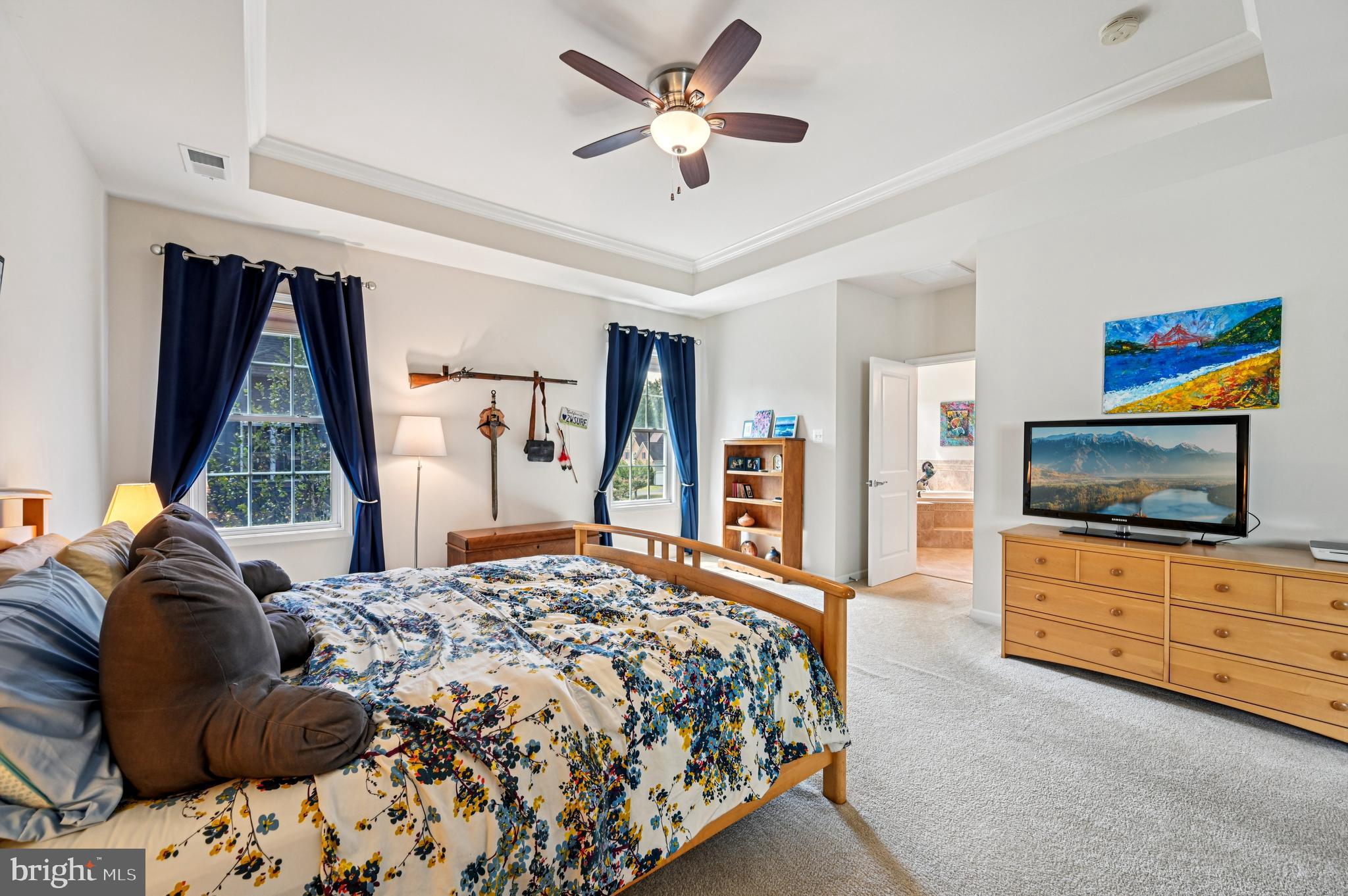 4884 Castlebridge Road Ellicott City, MD 21042 - Photo 65 of 130 a bedroom with a bed and a flat screen television