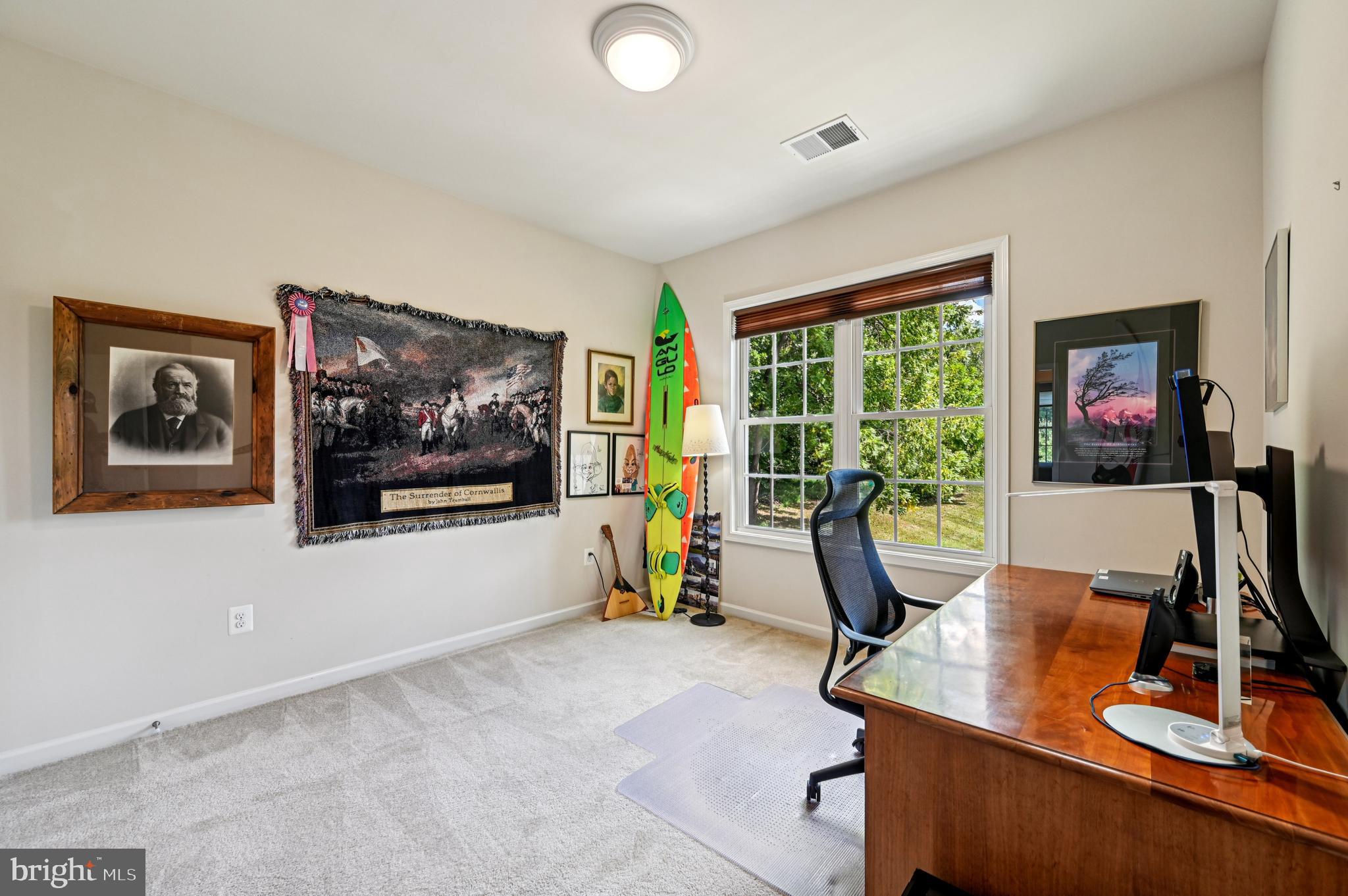 4884 Castlebridge Road Ellicott City, MD 21042 - Photo 76 of 130 a view of a workspace with furniture and a flat screen tv