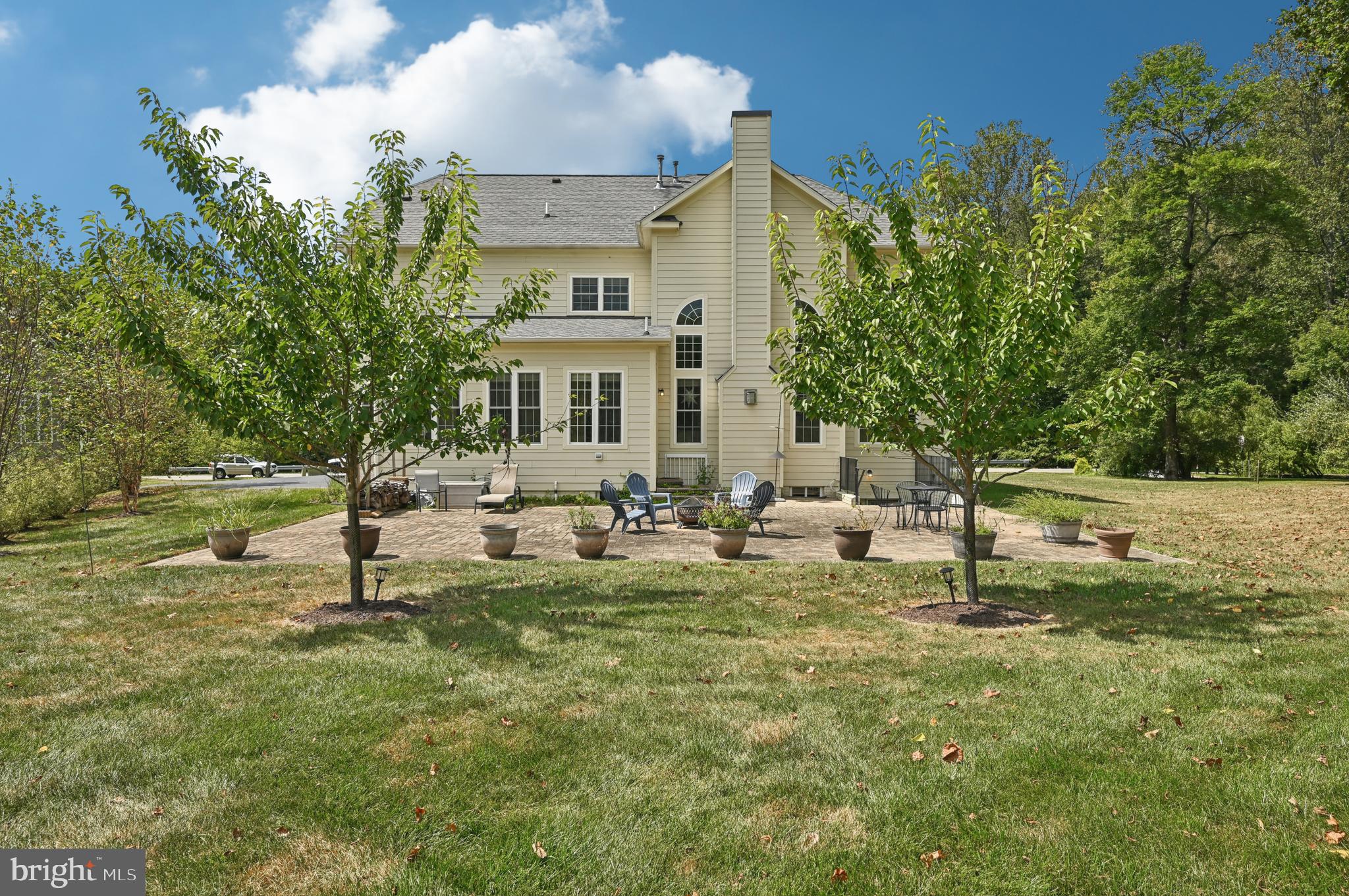 4884 Castlebridge Road Ellicott City, MD 21042 - Photo 89 of 130 a view of a house with backyard porch and sitting area