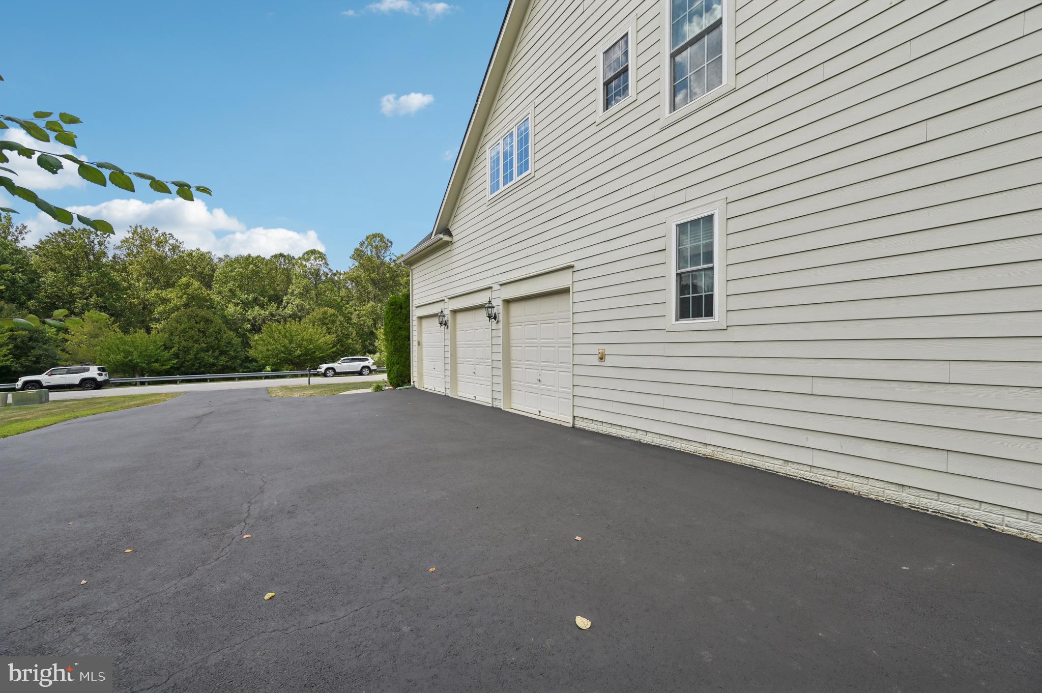 4884 Castlebridge Road Ellicott City, MD 21042 - Photo 97 of 130 a view of a house with a garage