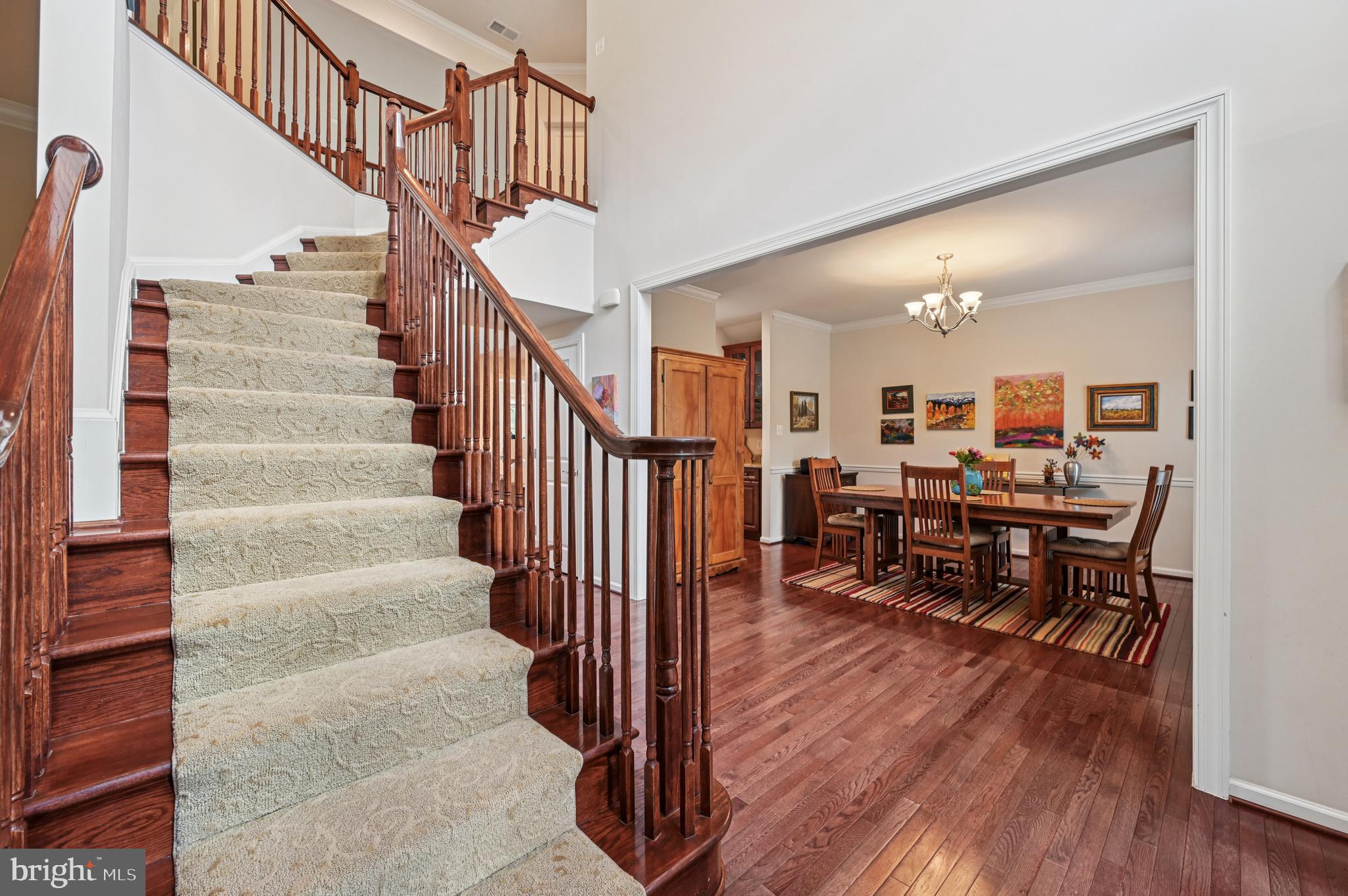 4884 Castlebridge Road Ellicott City, MD 21042 - Photo 10 of 130 a view of entryway and dining room and hall with wooden floor