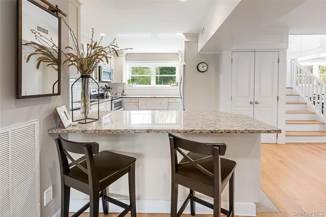 a dining room with furniture window wooden floor