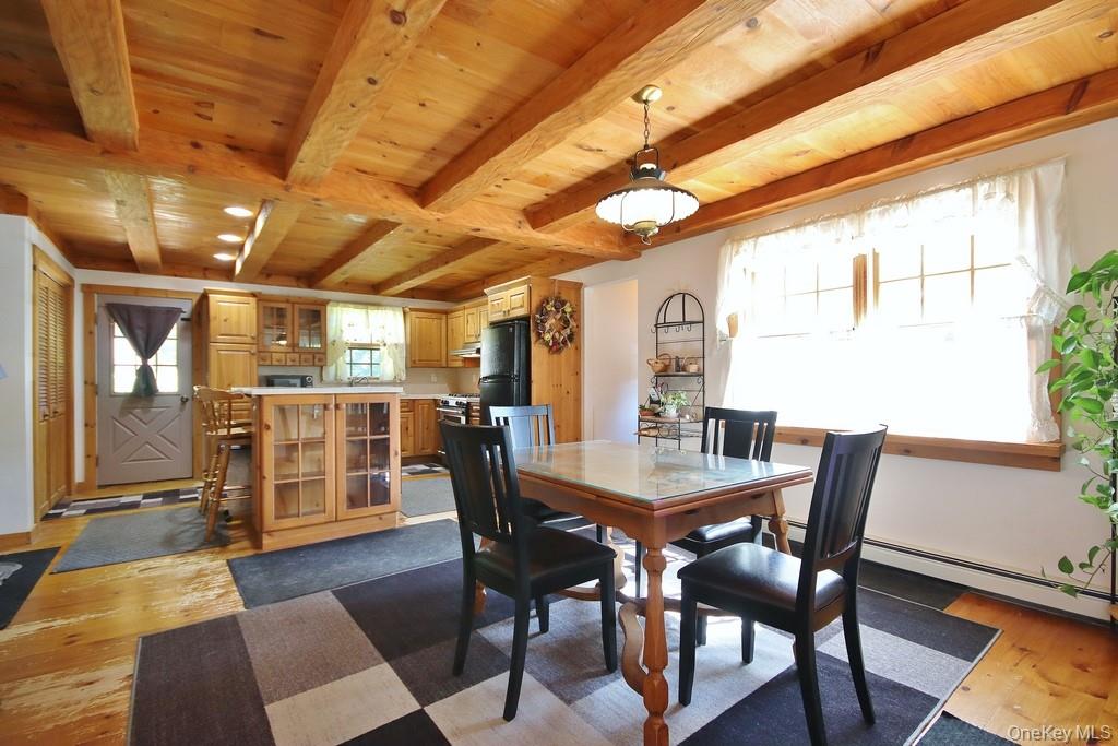 138 Round Hill Road Walden, NY 12586 - Photo 48 of 48 a view of a dining room with furniture window and wooden floor