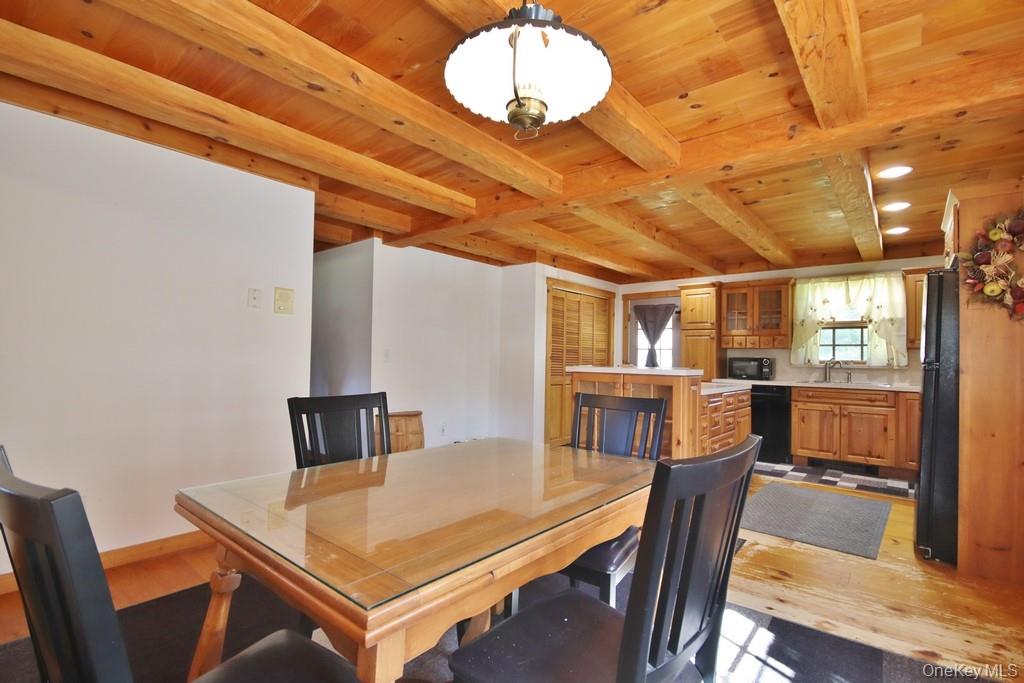 138 Round Hill Road Walden, NY 12586 - Photo 12 of 48 a view of a dining room with furniture and a chandelier