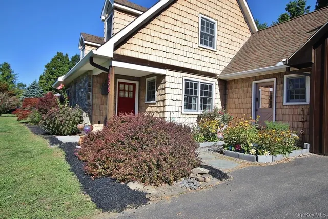 front view of a house with a yard