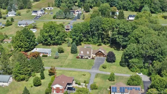 an aerial view of a house with outdoor space
