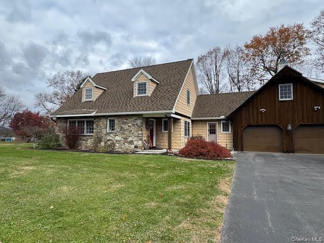 138 Round Hill Road Walden, NY 12586 - Photo 45 of 48 a front view of a house with a garden and plants