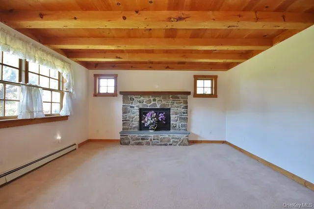 a living room with fireplace and a fireplace