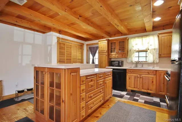 a kitchen with stainless steel appliances granite countertop a stove a sink and dishwasher