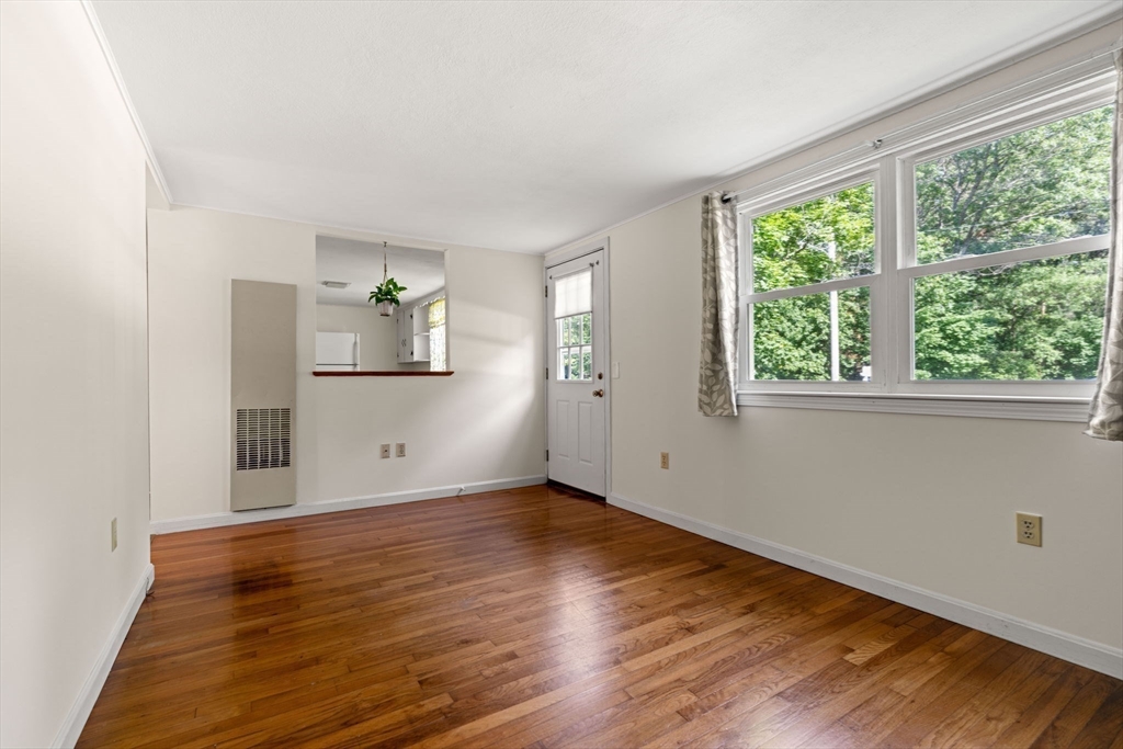 52 Middle Road Merrimac, MA 01860 - Photo 7 of 24 a view of empty room with wooden floor and fan