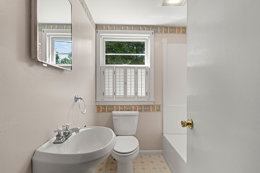 52 Middle Road Merrimac, MA 01860 - Photo 8 of 24 a bathroom with a toilet a sink and a window
