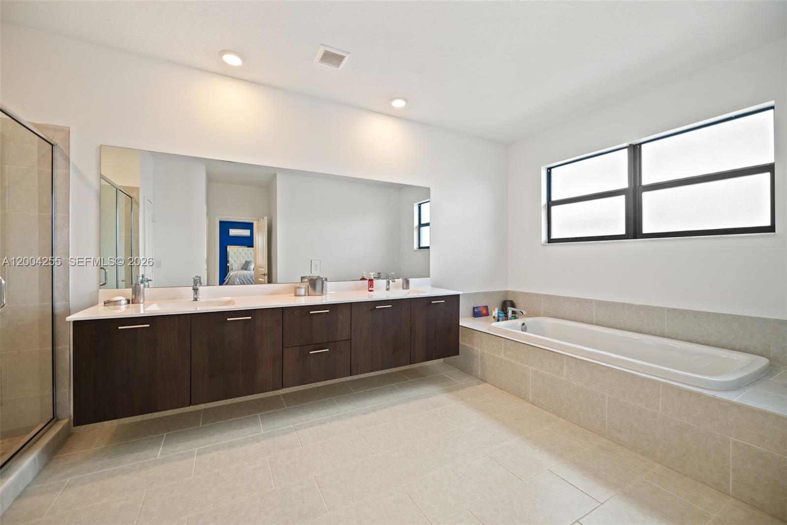 4366 Southwest 174th Avenue Miramar, FL 33029 - Photo 13 of 42 a large bathroom with a large tub and sink