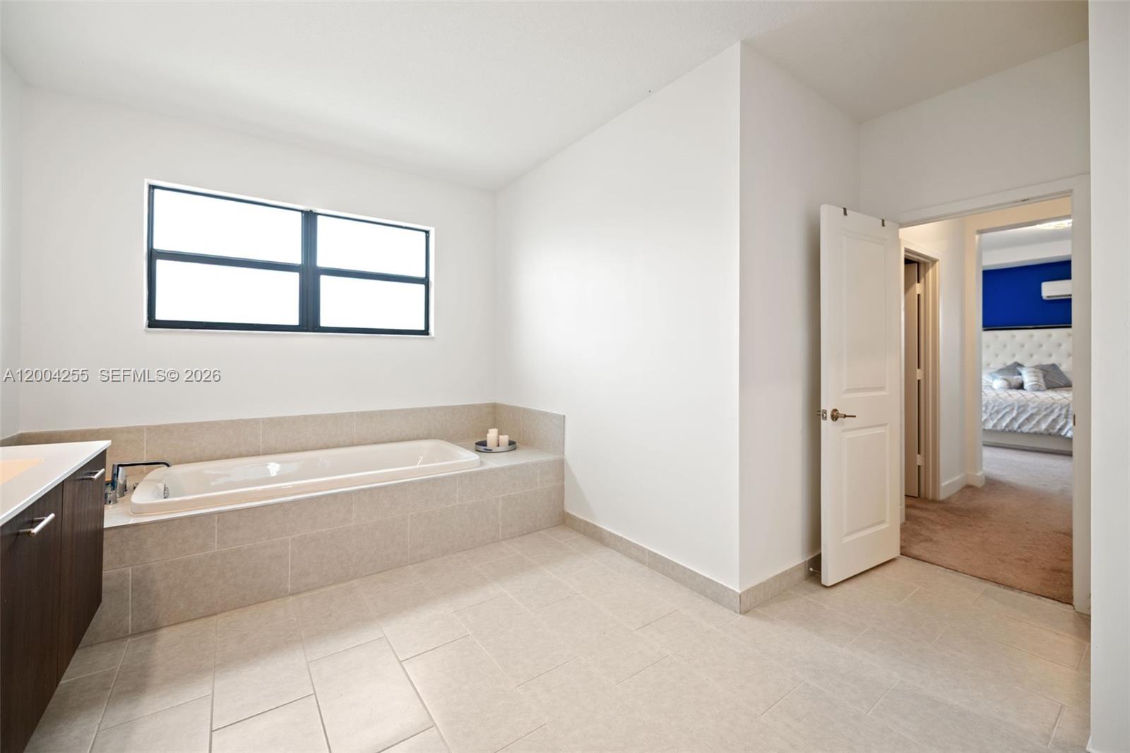 4366 Southwest 174th Avenue Miramar, FL 33029 - Photo 15 of 42 a spacious bathroom with a bathtub and a shower