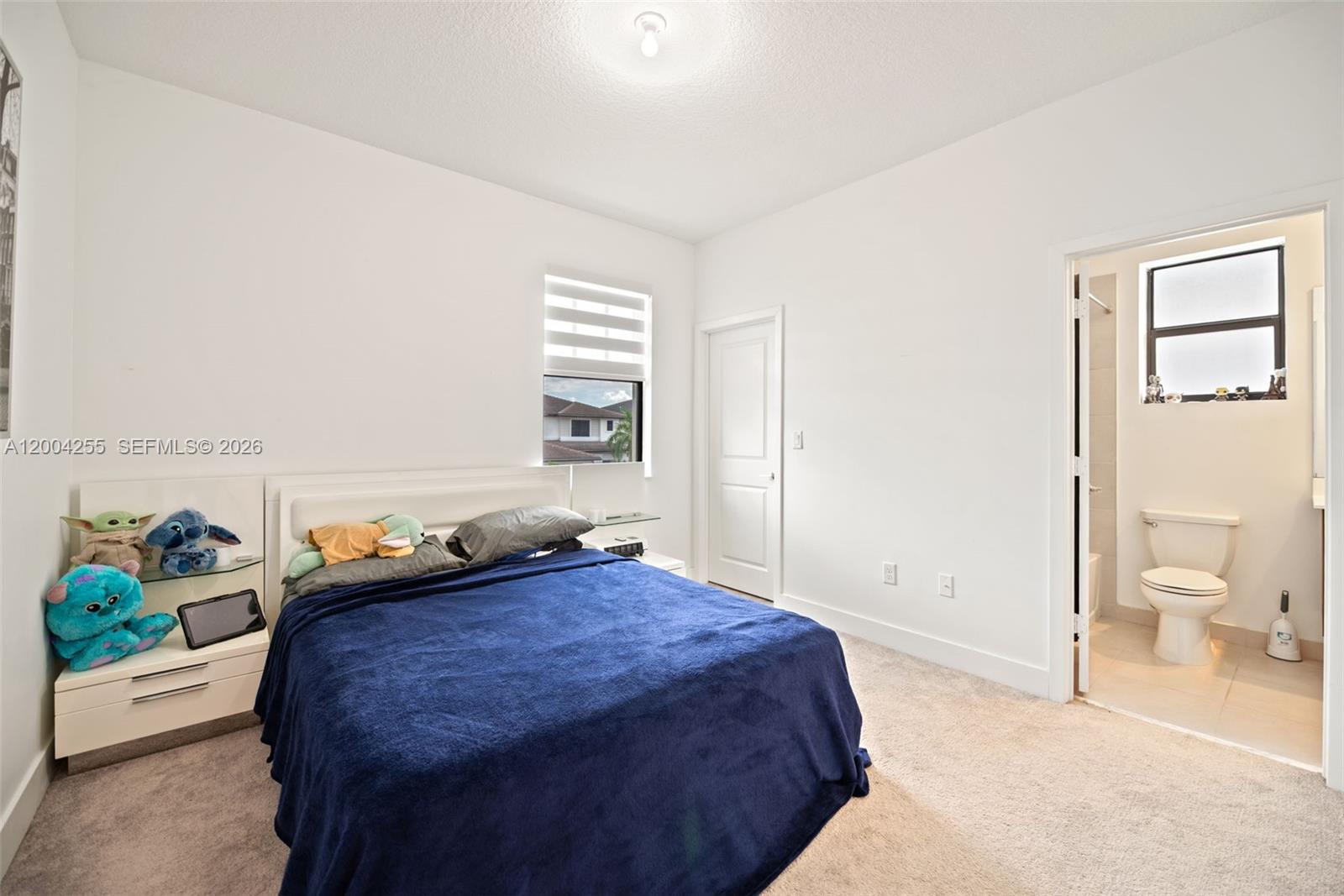 4366 Southwest 174th Avenue Miramar, FL 33029 - Photo 18 of 42 a bedroom with a bed and a couch