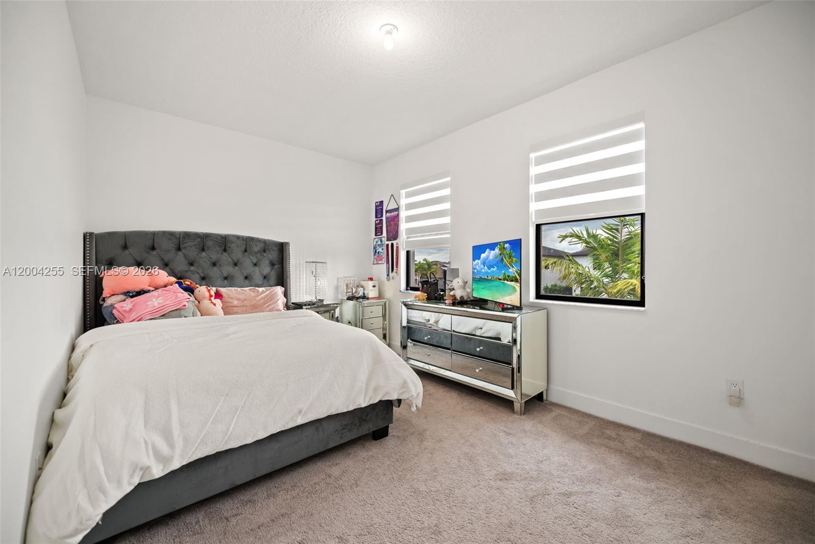 4366 Southwest 174th Avenue Miramar, FL 33029 - Photo 19 of 42 a bedroom with a bed and a window