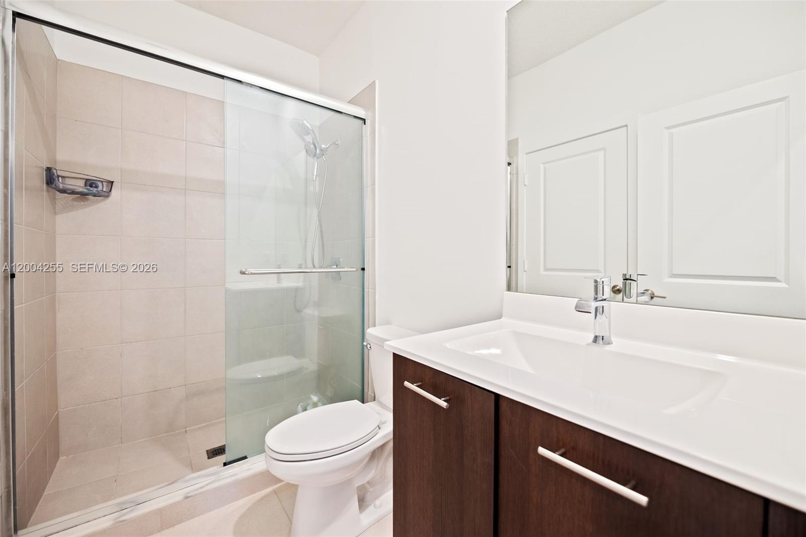 4366 Southwest 174th Avenue Miramar, FL 33029 - Photo 20 of 42 a bathroom with a sink a toilet and shower