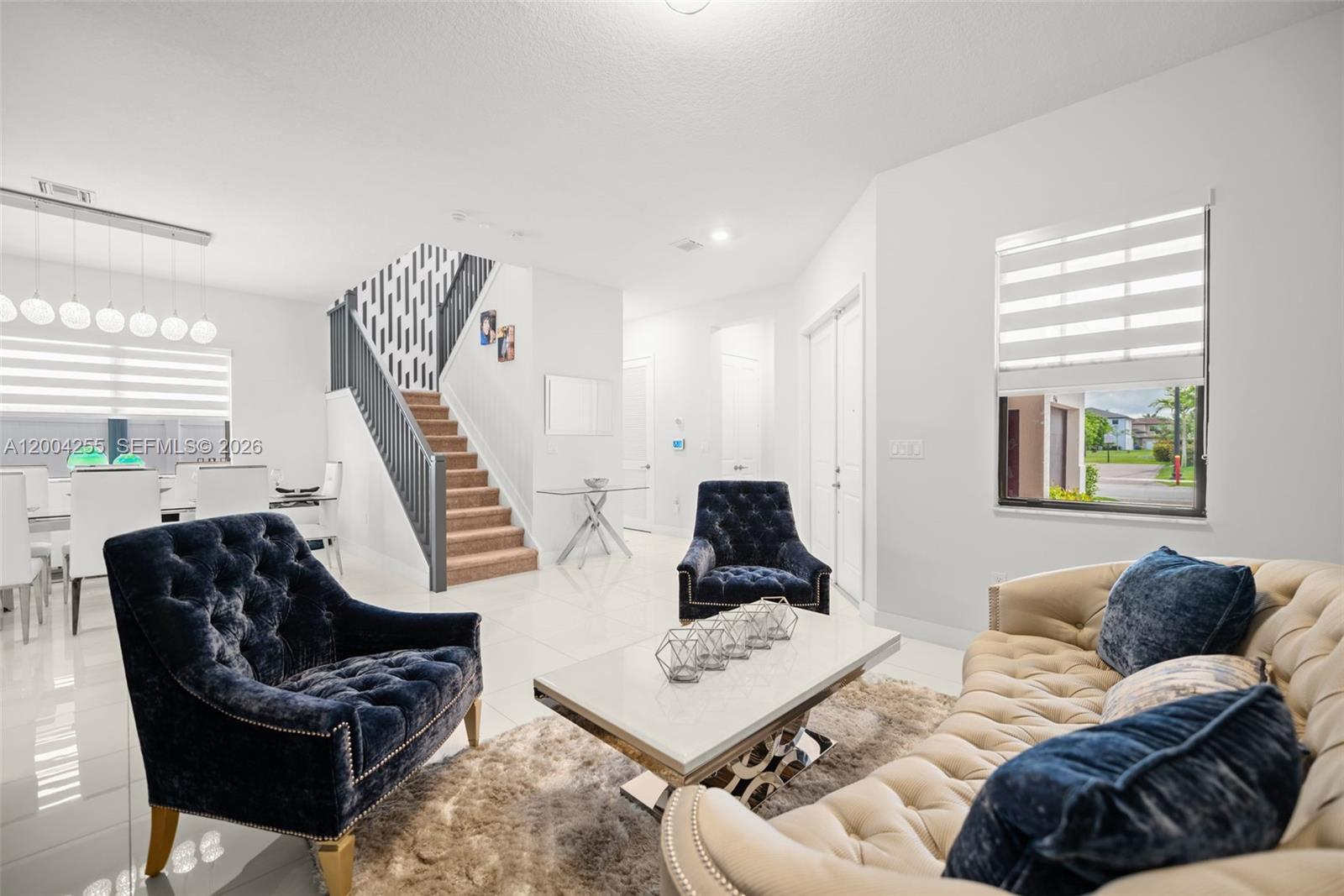 4366 Southwest 174th Avenue Miramar, FL 33029 - Photo 2 of 42 a living room with furniture and a large window