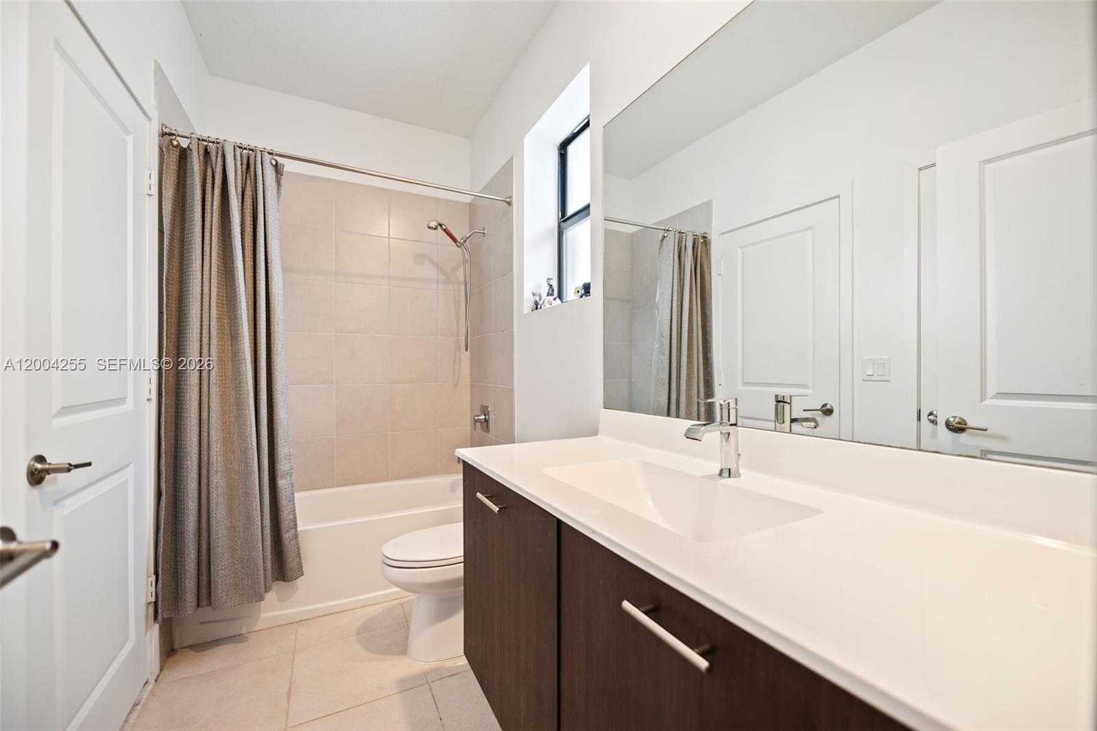 4366 Southwest 174th Avenue Miramar, FL 33029 - Photo 22 of 42 a bathroom with a sink a toilet and shower