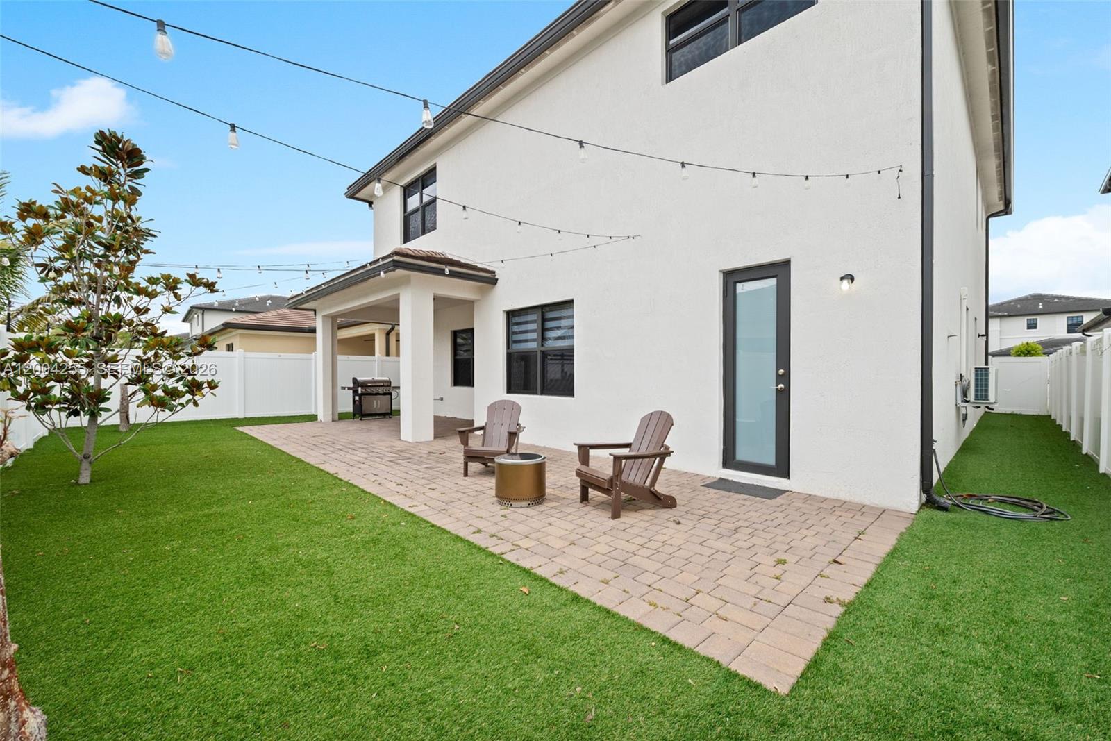 4366 Southwest 174th Avenue Miramar, FL 33029 - Photo 24 of 42 a front view of house with yard and outdoor seating