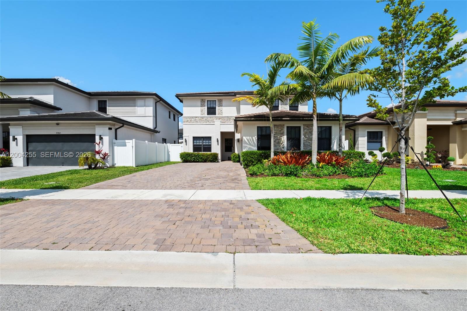 4366 Southwest 174th Avenue Miramar, FL 33029 - Photo 26 of 42 a front view of house with yard and green space