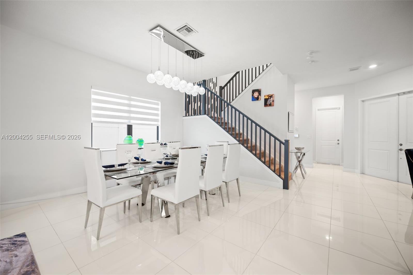 4366 Southwest 174th Avenue Miramar, FL 33029 - Photo 5 of 42 a view of dining room and hall with a dining table
