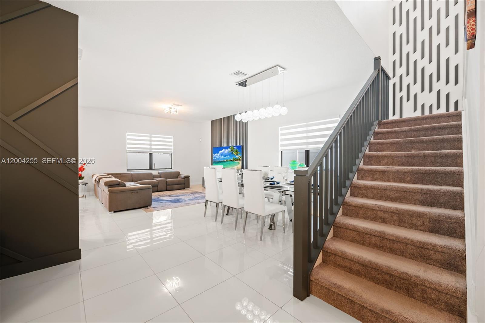 4366 Southwest 174th Avenue Miramar, FL 33029 - Photo 6 of 42 a living room with furniture and a flat screen tv