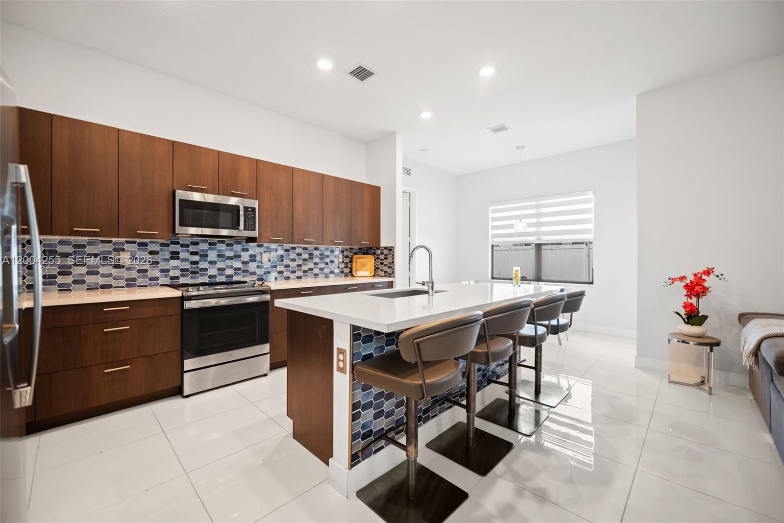 4366 Southwest 174th Avenue Miramar, FL 33029 - Photo 7 of 42 a kitchen with a wooden cabinets and counter space