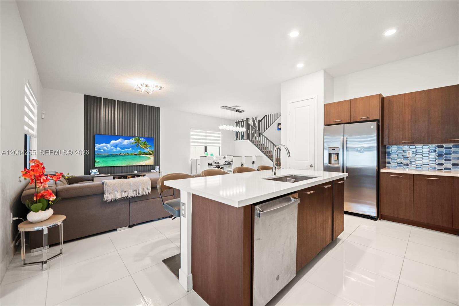 4366 Southwest 174th Avenue Miramar, FL 33029 - Photo 8 of 42 a kitchen with stainless steel appliances kitchen island granite countertop a sink and cabinets