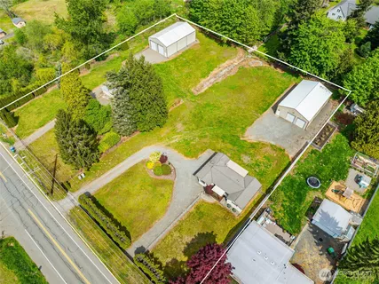 an aerial view of a house with a swimming pool