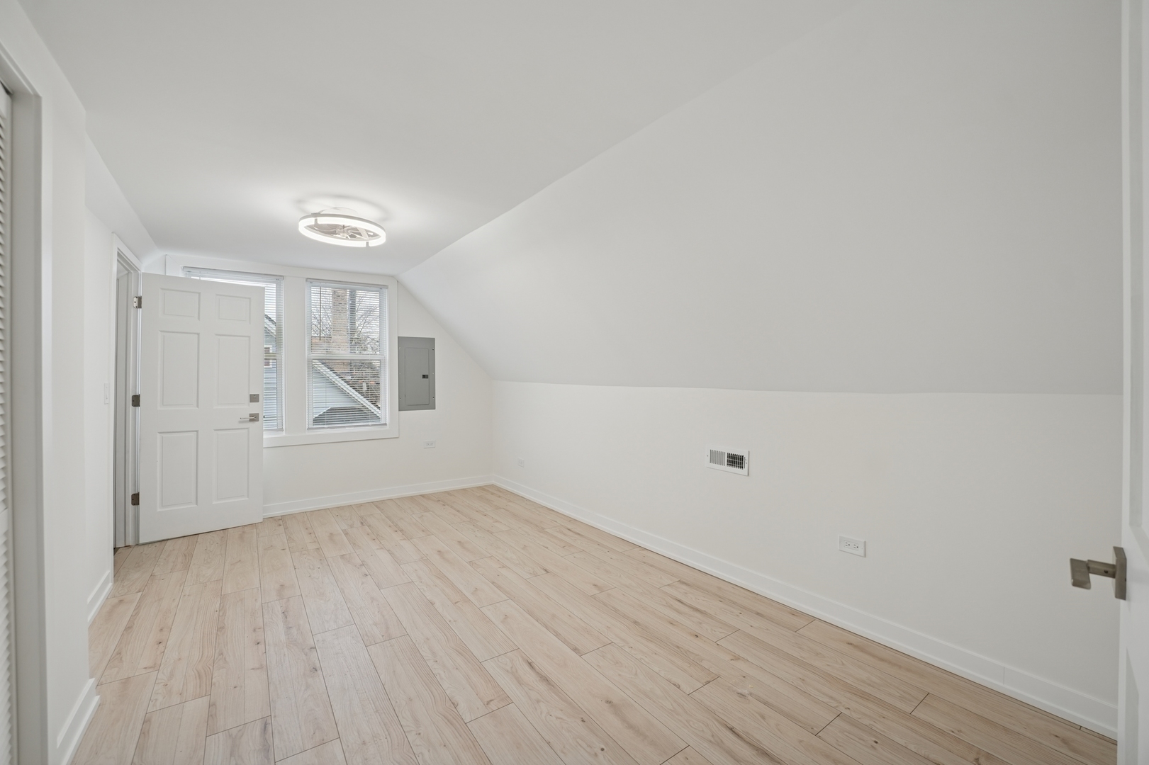 4954 West Byron Street Chicago, IL 60641 - Photo 11 of 33 a view of an empty room with wooden floor and a window