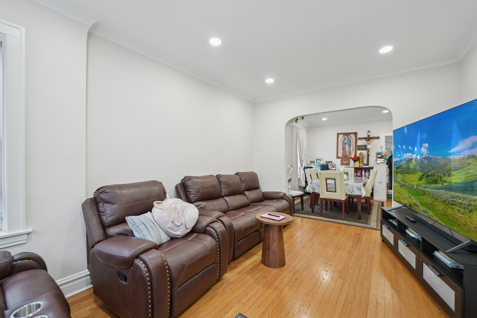 4954 West Byron Street Chicago, IL 60641 - Photo 15 of 25 a living room with furniture and a flat screen tv