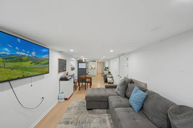 a living room with furniture a projector and a projector