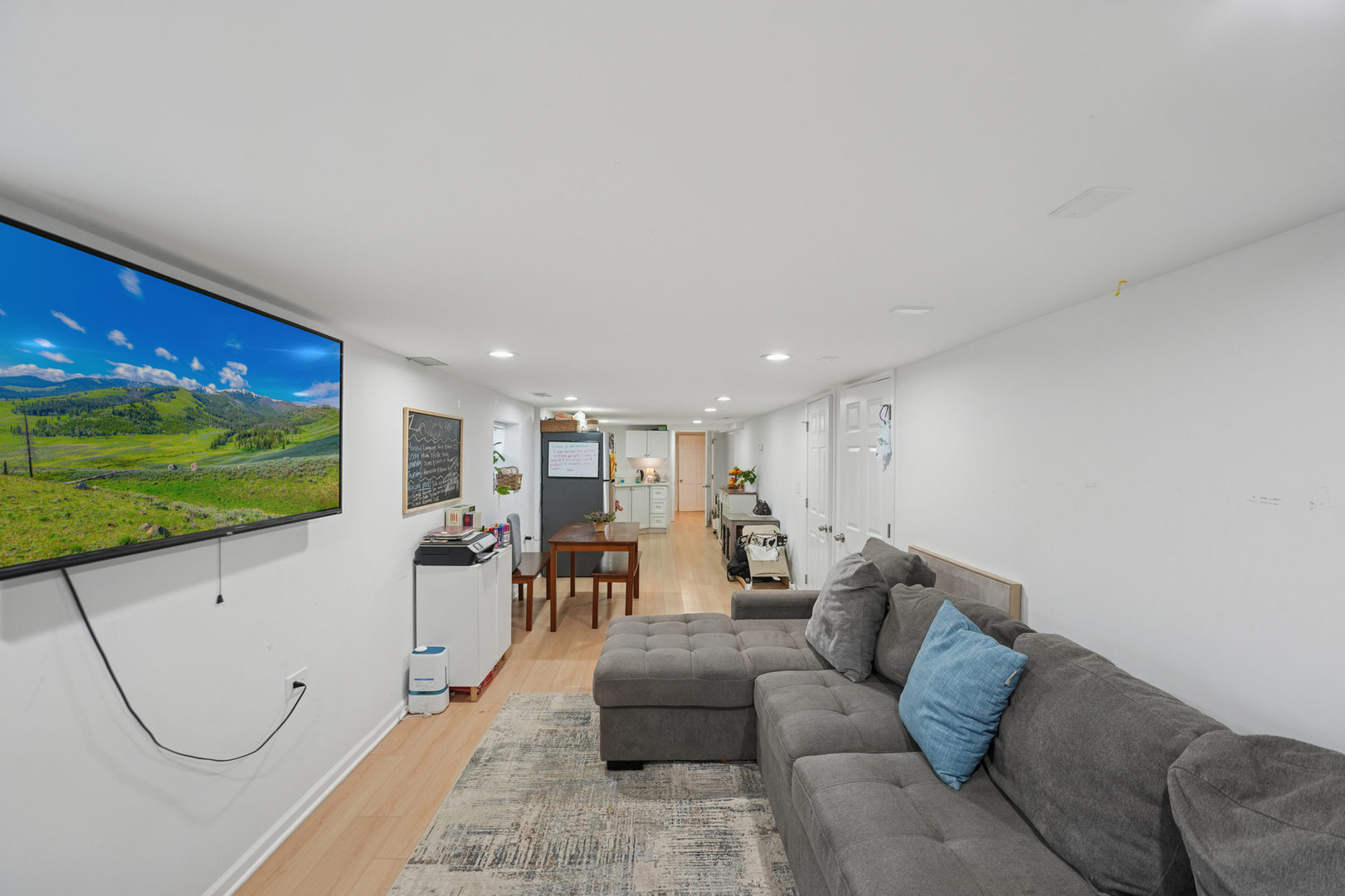 4954 West Byron Street Chicago, IL 60641 - Photo 15 of 33 a living room with furniture a projector and a projector