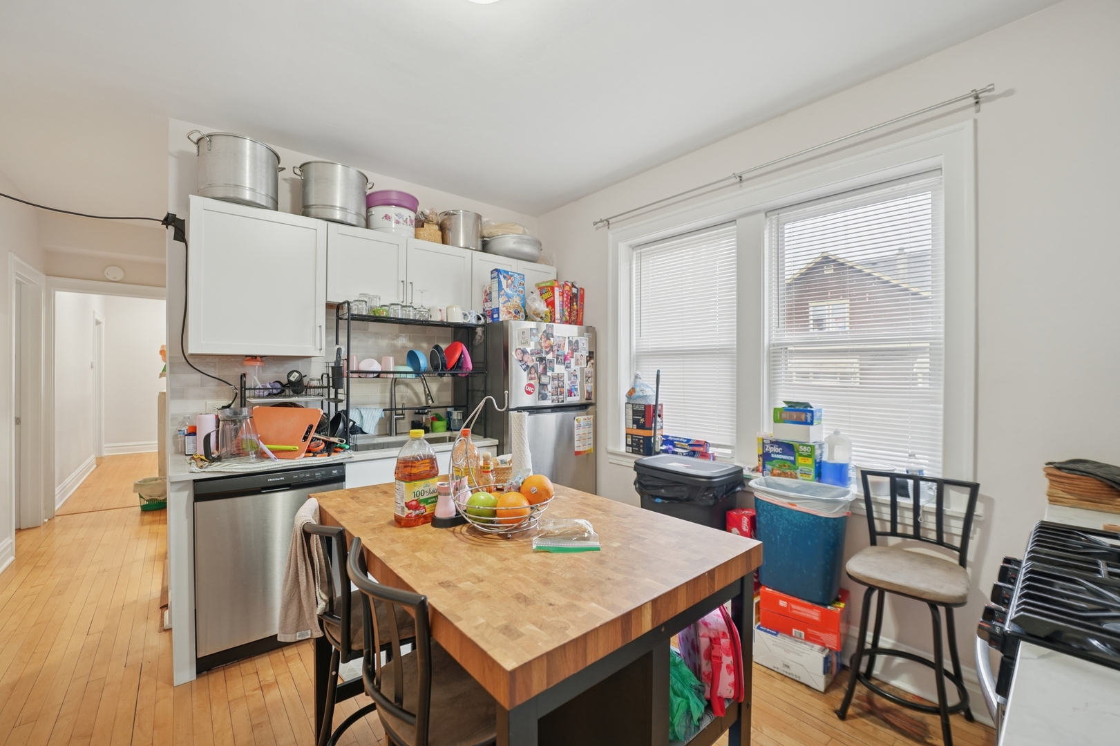 4954 West Byron Street Chicago, IL 60641 - Photo 17 of 25 a view of a dining room with furniture window and wooden floor