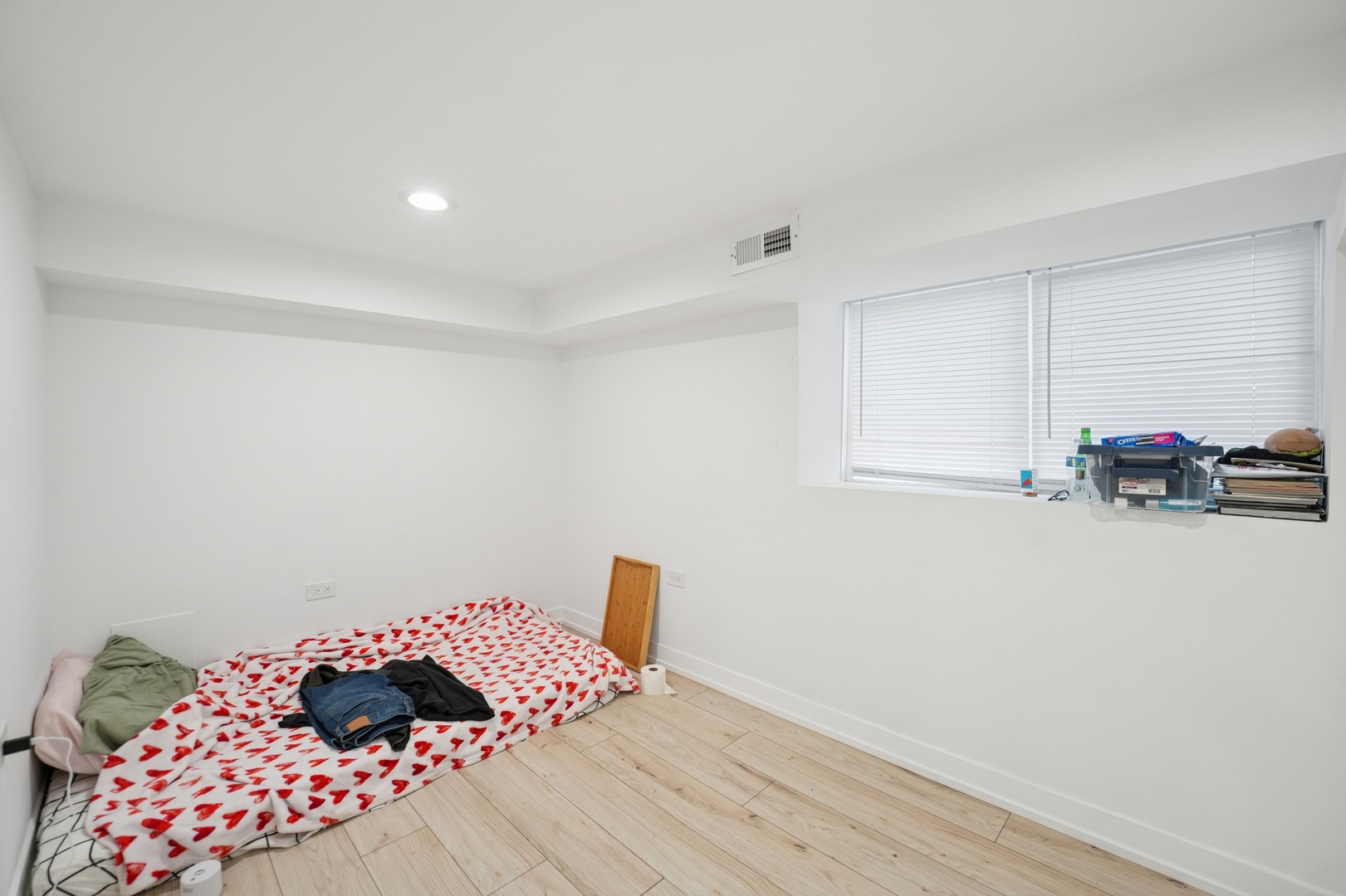 4954 West Byron Street Chicago, IL 60641 - Photo 32 of 33 a bedroom with a bed and a lamp