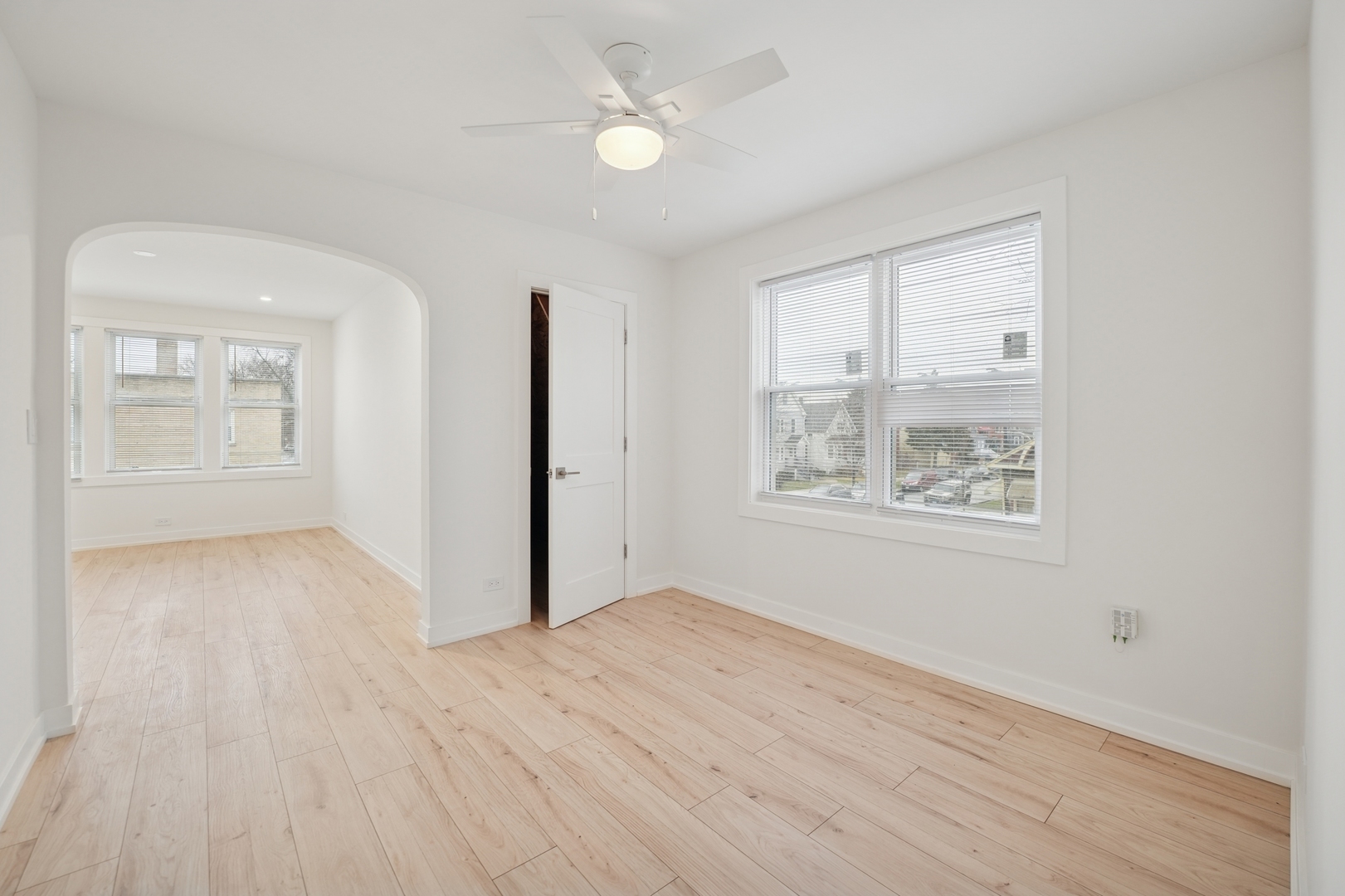 4954 West Byron Street Chicago, IL 60641 - Photo 8 of 33 wooden floor in an empty room with a window